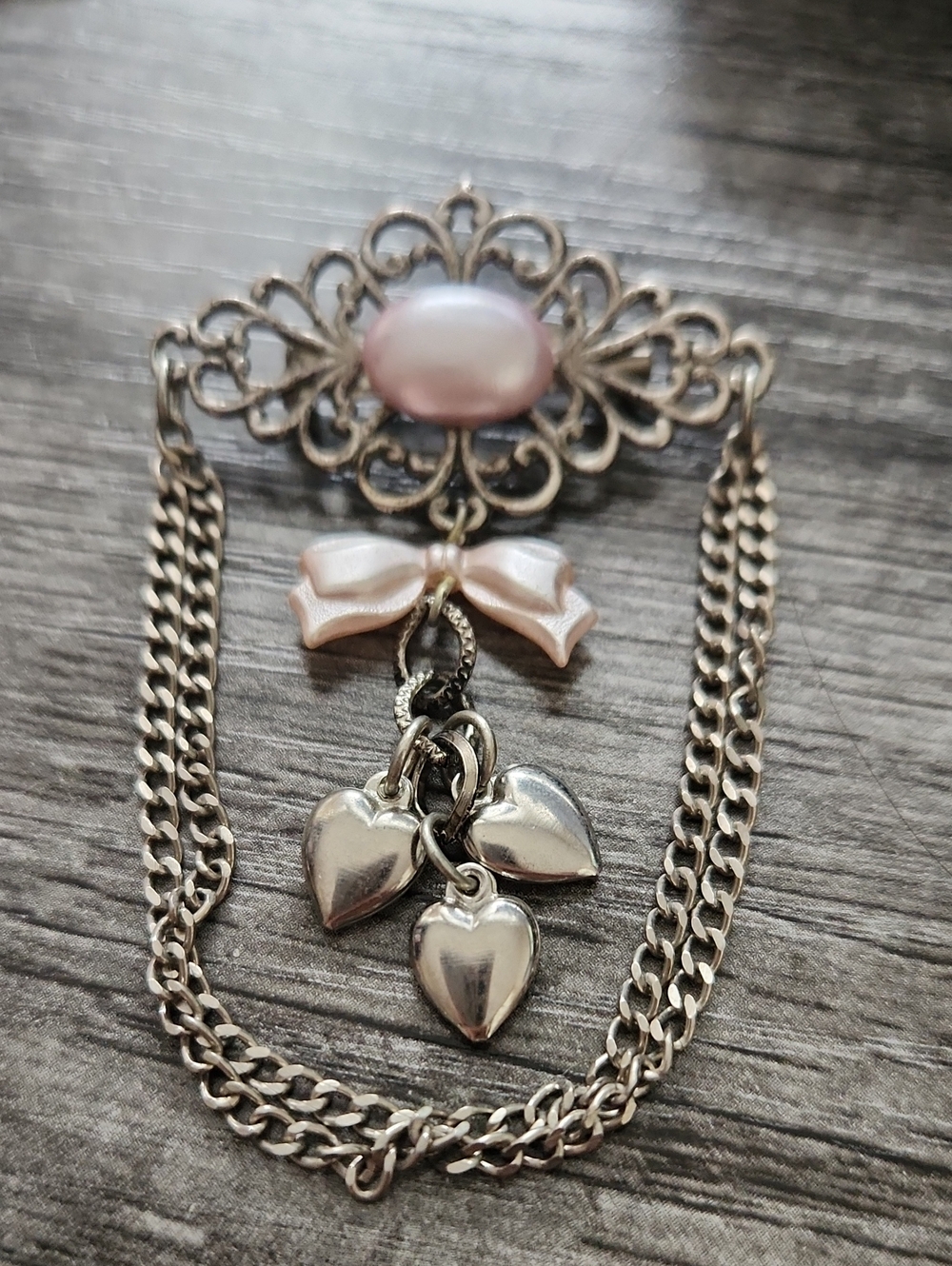 Silver Filigree Brooch with Pink Pearl and Ribbon